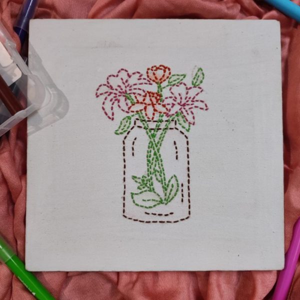Hand embroidered canvas with flower vase